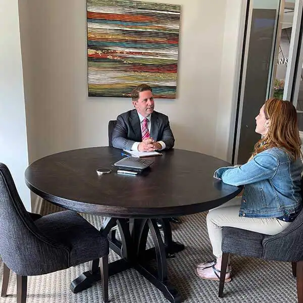 chad-meeting-conference-room-law-office Personal Injury Attorney Chad Rankin Discussing an Accident Case in their Lancaster law firm office.